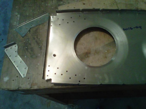 Holes drilled and deburred. Lighting holes are flanged