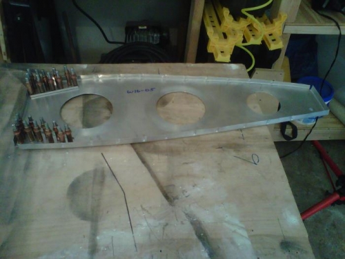 Gussets clecoed to ribs, ready for riveting.