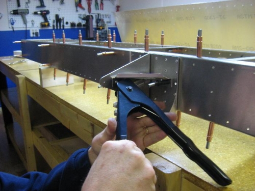 Hand riveting bracket