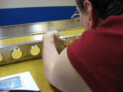 Drilling out holes for ribs.