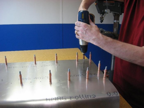 Using portable drill.