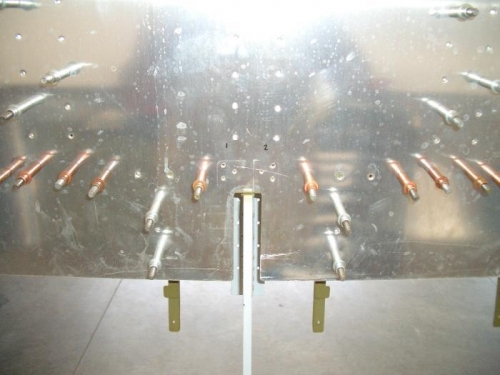 Drill stiffener holes