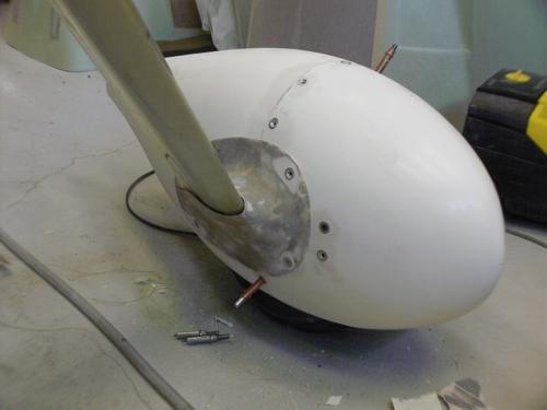 Tinnerman washer epoxied in place and fairing sanded