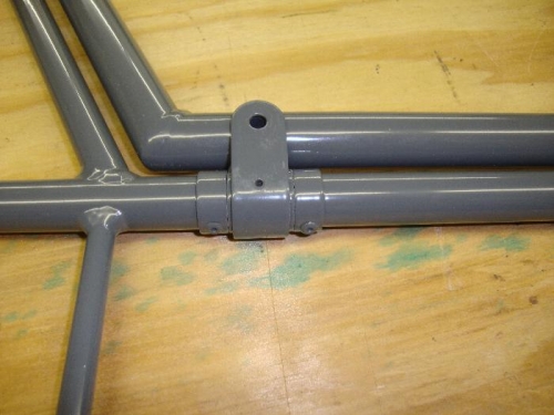 Elevator hinge position riveted