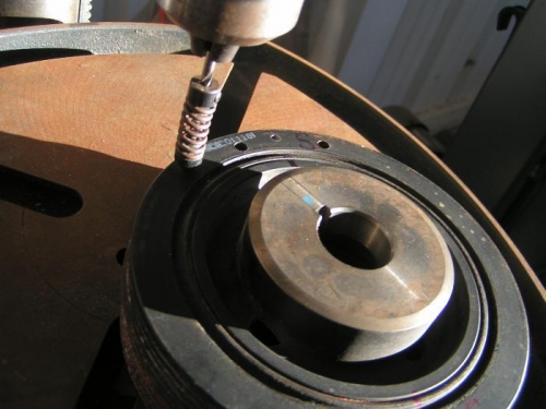 Drilling magnet holes in pulley