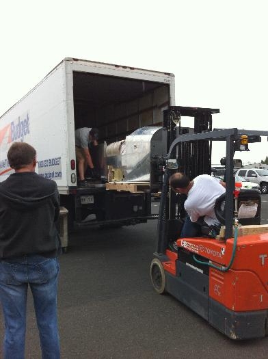 The fuselage carefully guided into position