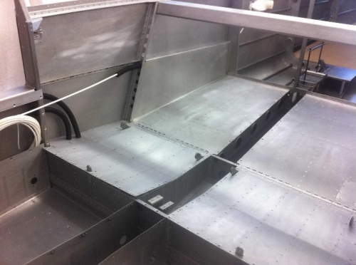 Baggage area access cover over static line