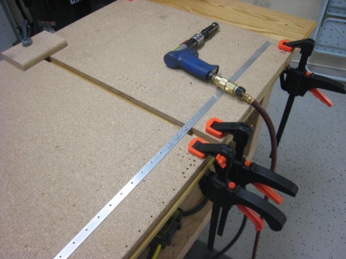 Countersink set up.  By leaving a space in the work surface, you can angle the CS cage.