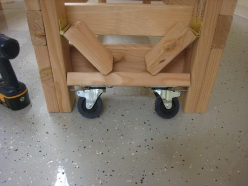 When installed correctly, the wheels can retract, setting the table down on its legs.