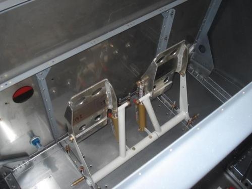 Brackets riveted and rudder pedal assembly checked for fit