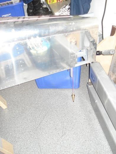 Plumb bob off the centre line in the tail.