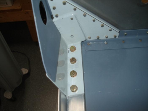 Four bolt holes clecoed.