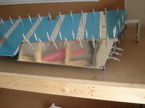 Hinge and tab clecoed in place