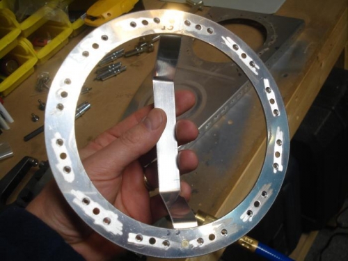 Anti=hang up bracket riveted in place