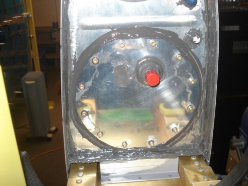 Cover sealed and screwed in place.