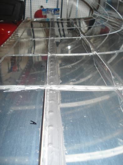 Layer of proseal over the rivets