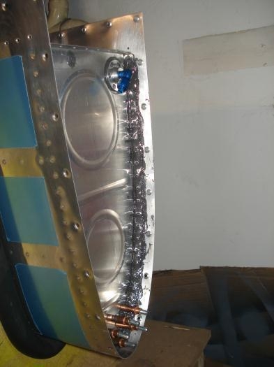 Outboard rib riveted in place