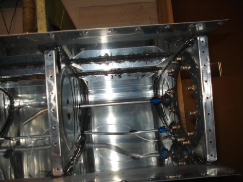 Interior shot of the inboard rib with the return fuel line draining in the second bay.