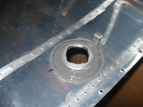 Fuel cap flange sealed with the fuel vent clip in place.