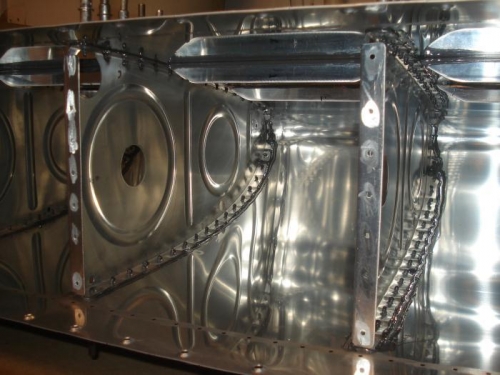 After the ribs are riveted, th eentire flange will be coated with proseal.