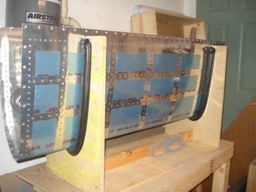 Bottom skin half riveted.