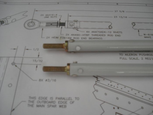 Rod ends riveted in place.