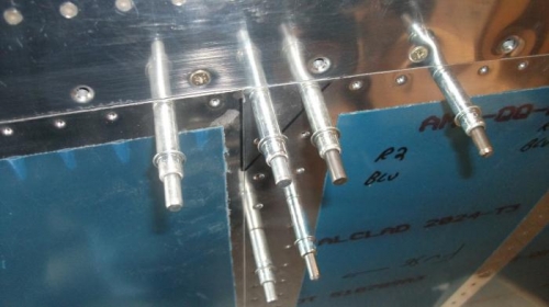 Outboard top skin dimpled and scarfed