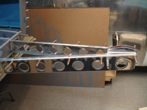 Baggage rib assembly clecoed