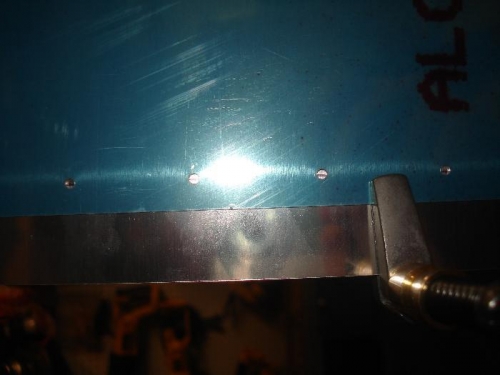 The 1/2 inch line on the W-423 seen through the rivet holes andclamped.