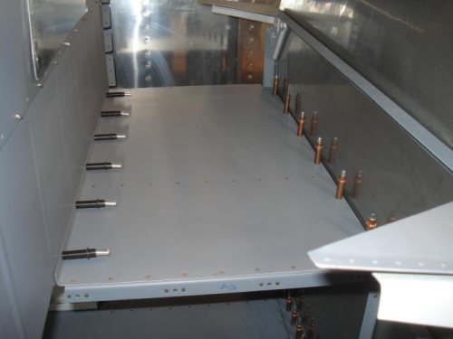 Baggage floor clecoed in place