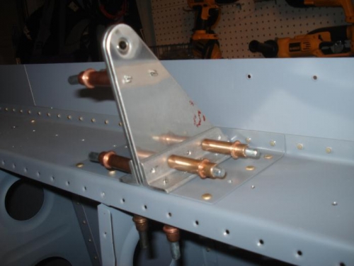 Inboard aileron bracket deburred and final drilled.