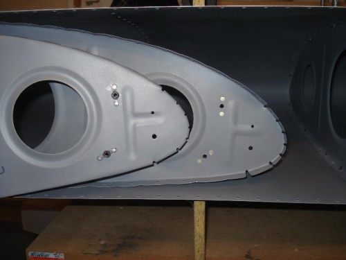 Nutplates riveted to the ribs for the reflector mount