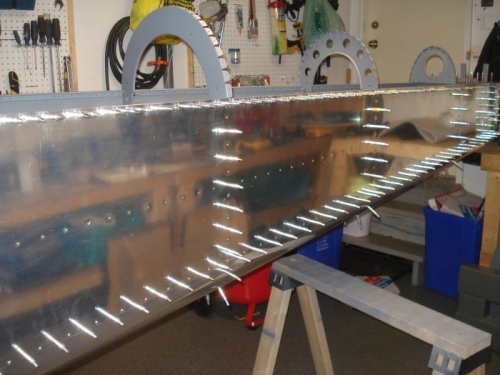 Bottom skin and bulkheads clecoed into position.