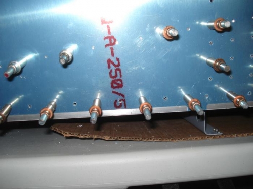 F-844-L-1 being riveted.  You can see the rivet line through the holes.