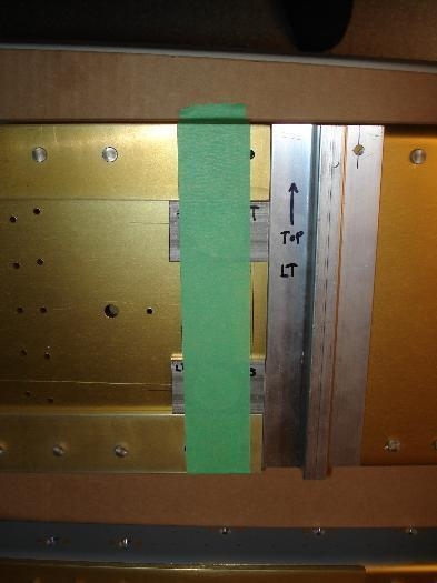 Spacers taped and plumb to the spar flange