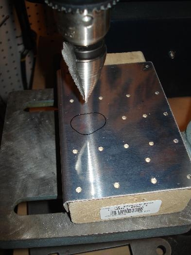 Used the unibit to remove some of the material