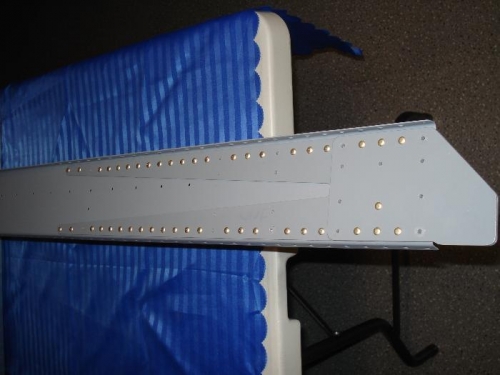 W-707G reinforcement forks for the rear spars riveted in place