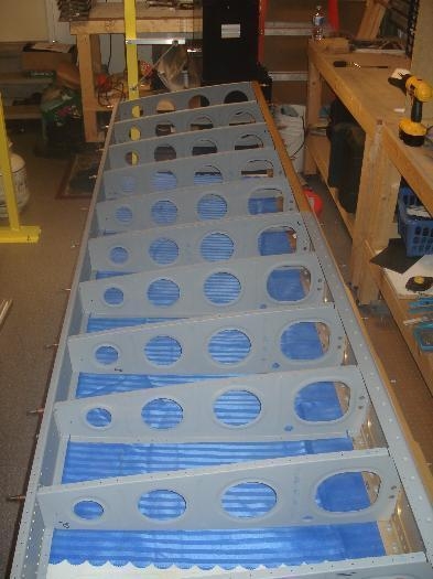 Left wing skeleton ready for riveting.