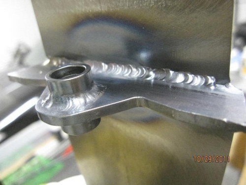 Lower bushing fitting welded
