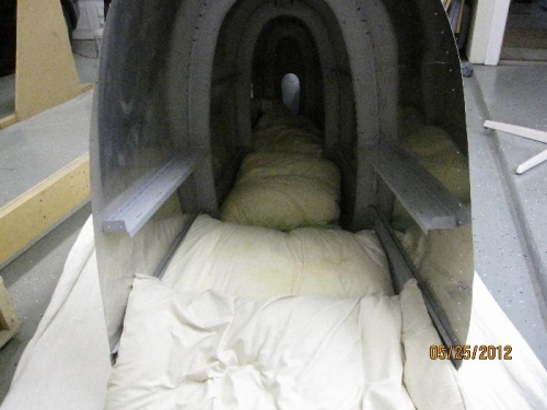 Showing fuselage floor lined with pillows