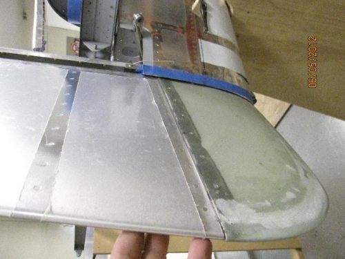 Trimming aft fuselage skin to allow rudder deflection