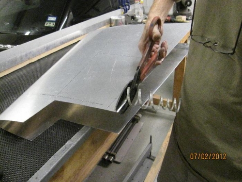 trimming aft edge of fin skin at rudder interface