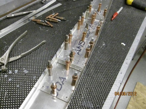Drilling splice plates to final size.