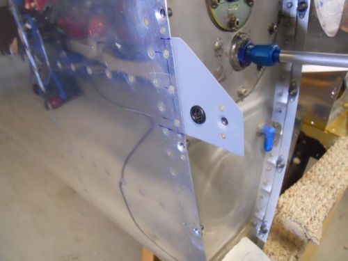 Bracket riveted to skin