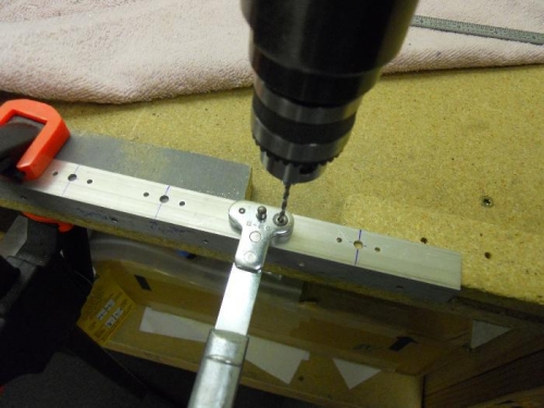 Using nutplate jig to drill for nutplate mounting
