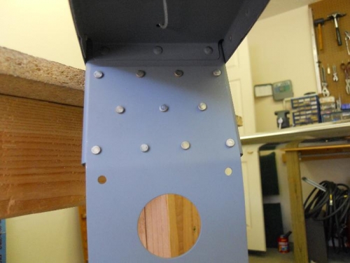 Attach plate riveted to VS front spar
