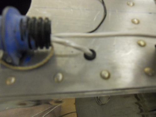 Tail light wire exits conduit-then thru gormmet