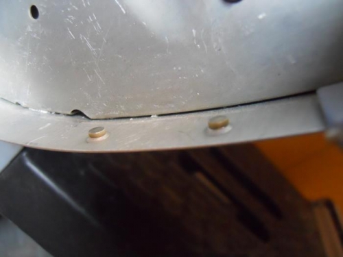 2 dummy rivets near nose of wing