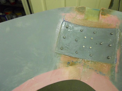 Backing plate riveted/glued to skirt
