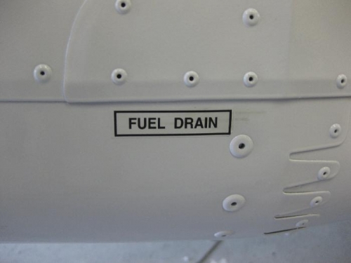 A total of 6 fuel drain stickers applied.